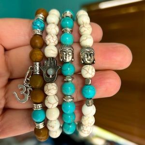 Four Buddah namaste Bracelets one price